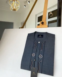 A Dark grey Irish petal embroidery detail and a mid-section flap button Swarovski African Kaftan