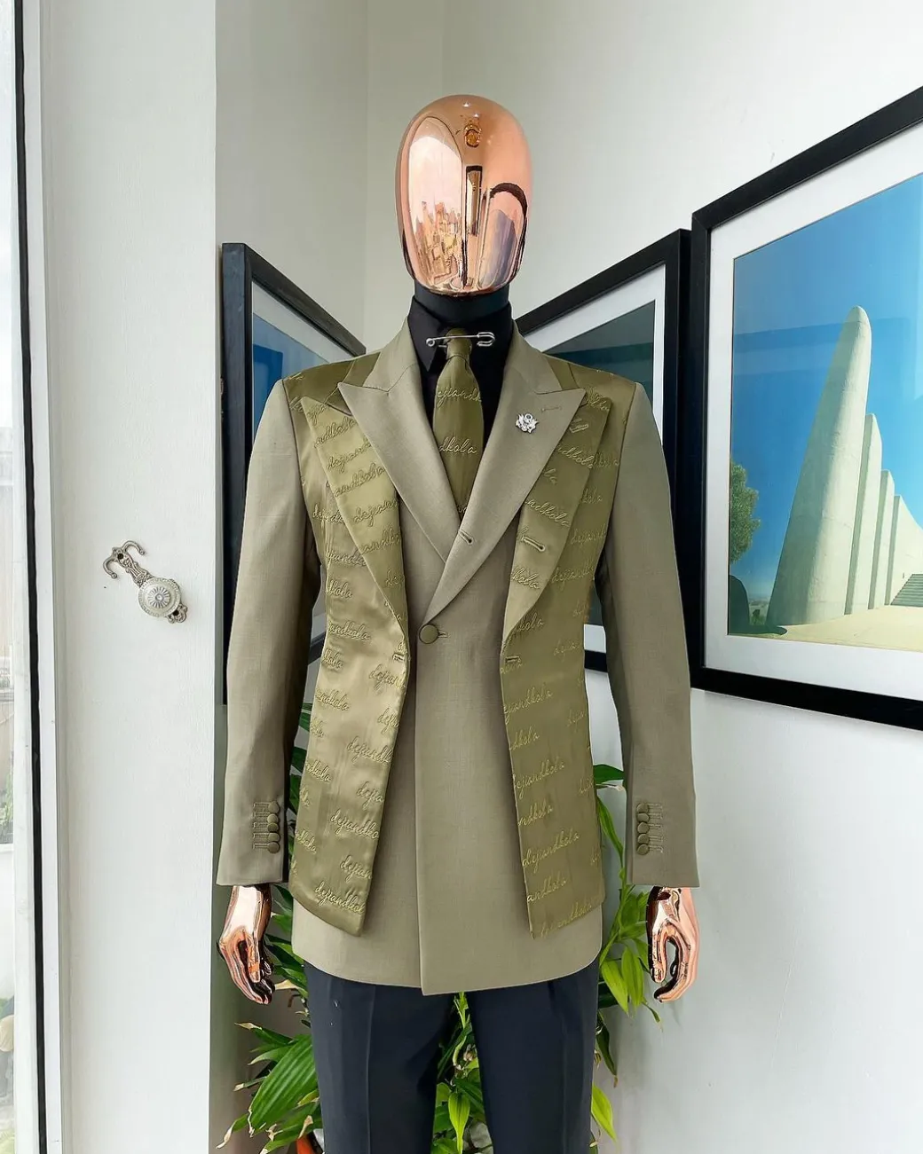 A Dark olive green “scritto” (inscribe your name), layered 4 lapels, double-breasted, out-waisted jointed jacket