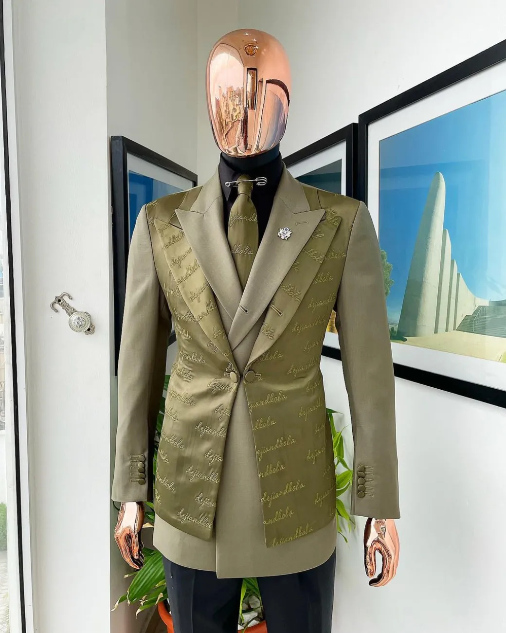 A Dark olive green “scritto” (inscribe your name), layered 4 lapels, double-breasted, out-waisted jointed jacket