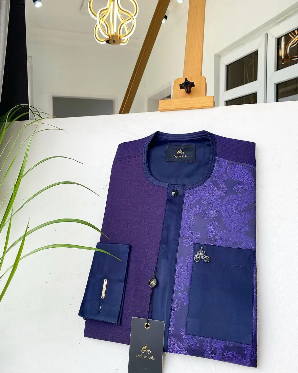 A dark purple matching paisley left section, and a silk blue flap and pocket with a Swarovski African Kaftan