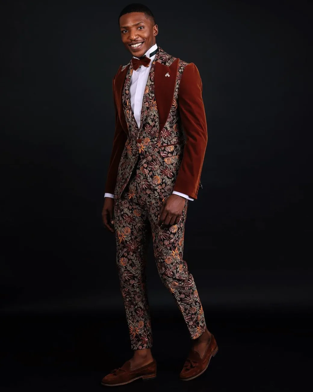 A “Dent” Floral Syrup Brown Metallic Jacquard Peak Quad Lapel Suit, Bow Tie & Gurkha Pant Trousers.