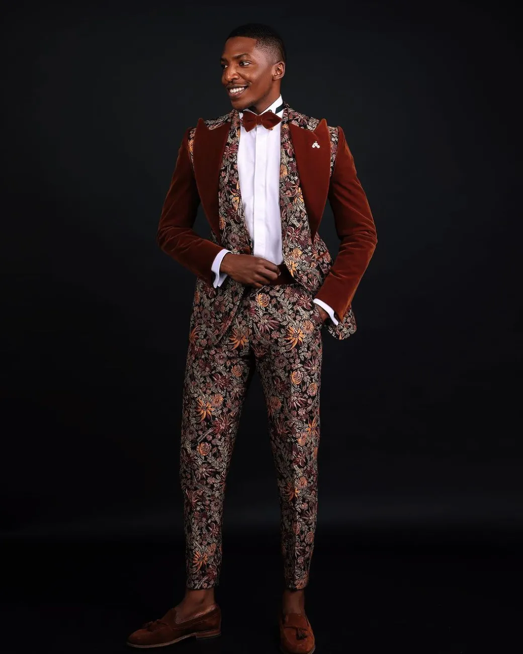 A “Dent” Floral Syrup Brown Metallic Jacquard Peak Quad Lapel Suit, Bow Tie & Gurkha Pant Trousers.