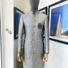 A Dispersed Silver & black metallic jacquard  reloaded “Namaste” Indian Sherwani Traditional wedding safari suit.