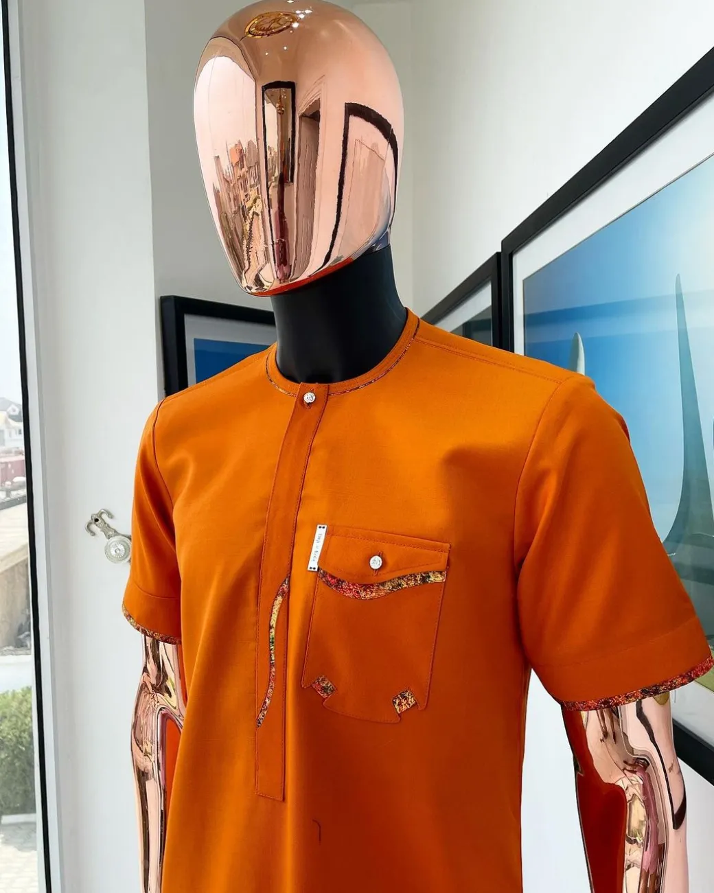 A Fire orange, combat pocket with matching paisley and Swarovski button detailing african traditional senator kaftan native.
