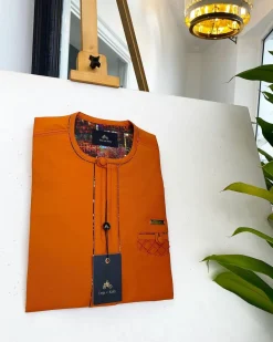 A Fire Orange, covered button, paisley design African traditional senator kaftan native.