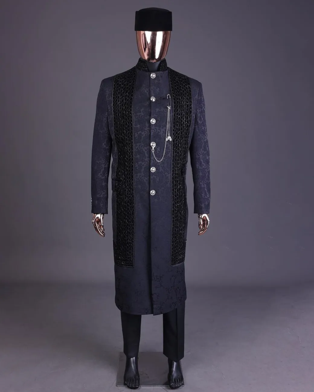 A floral midnight blue “wakanda” with L metallic embroidery, trench jacquard safari suit