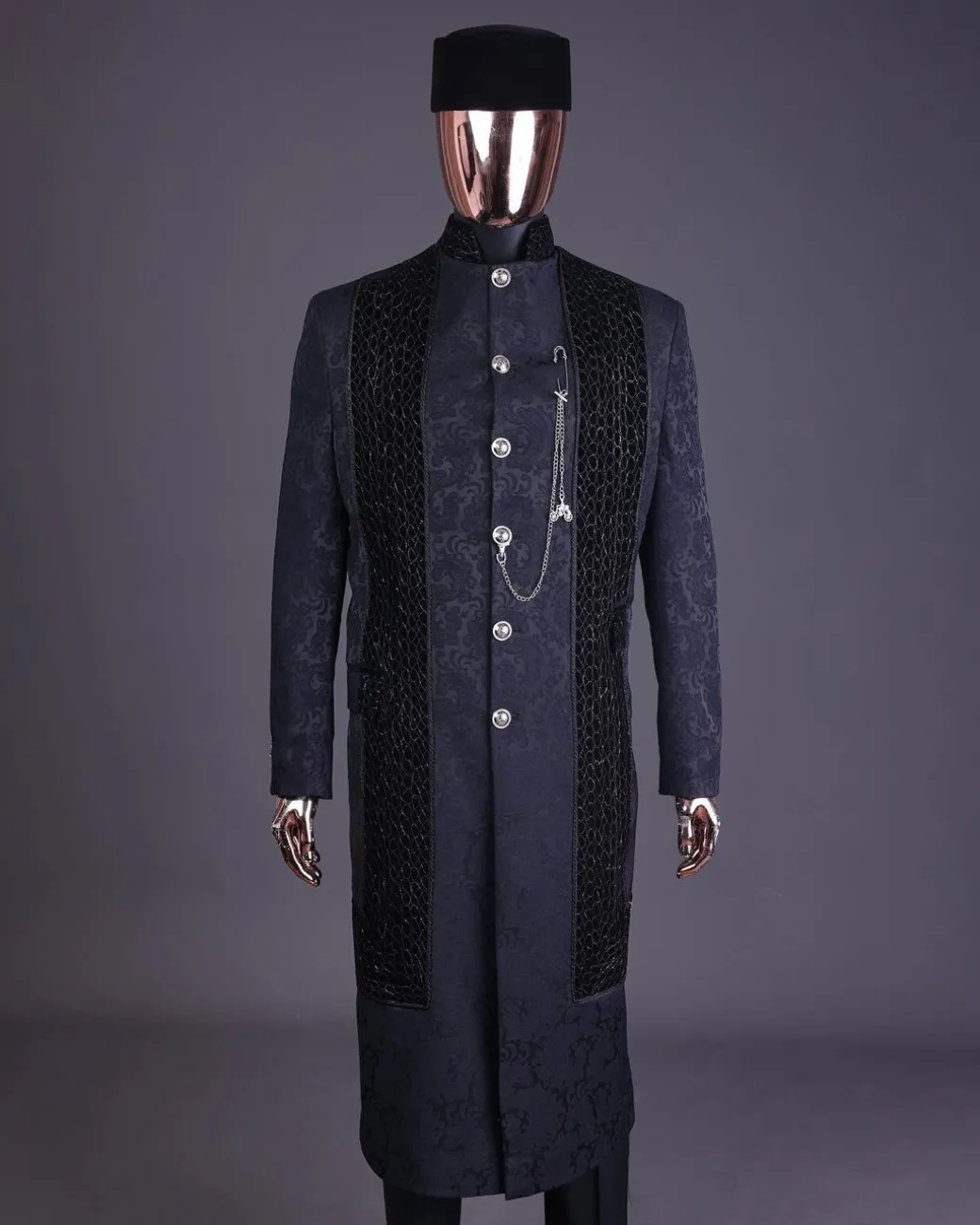 A floral midnight blue “wakanda” with L metallic embroidery, trench jacquard safari suit
