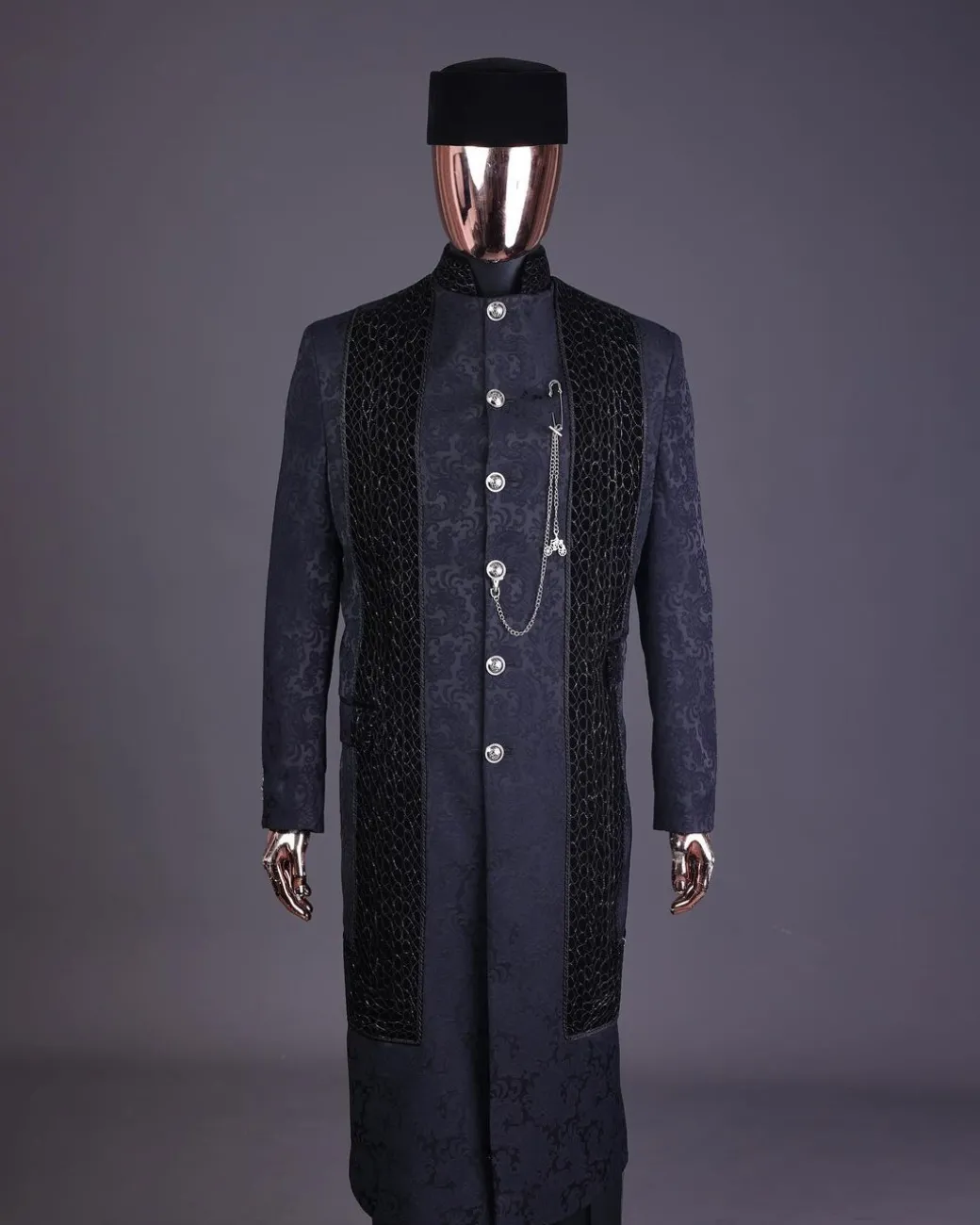A floral midnight blue “wakanda” with L metallic embroidery, trench jacquard safari suit