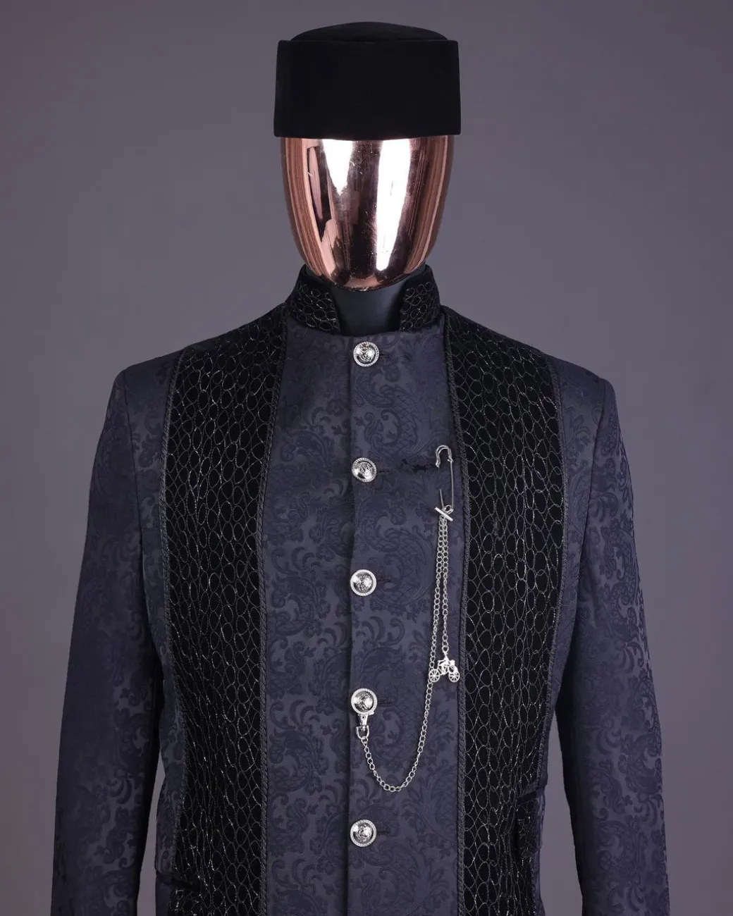 A floral midnight blue “wakanda” with L metallic embroidery, trench jacquard safari suit
