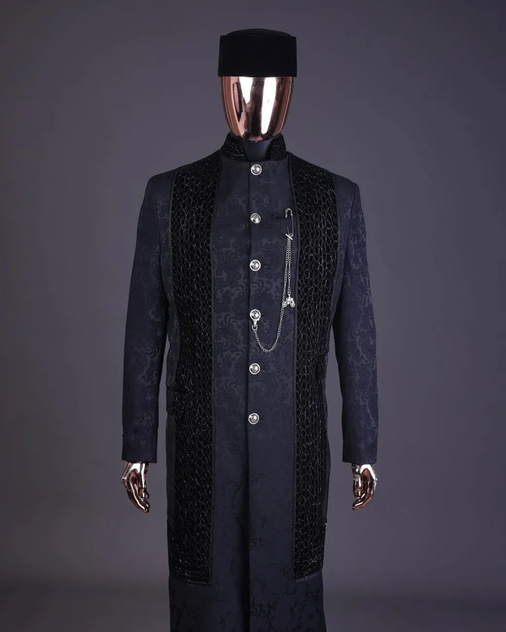 A floral midnight blue “wakanda” with L metallic embroidery, trench jacquard safari suit