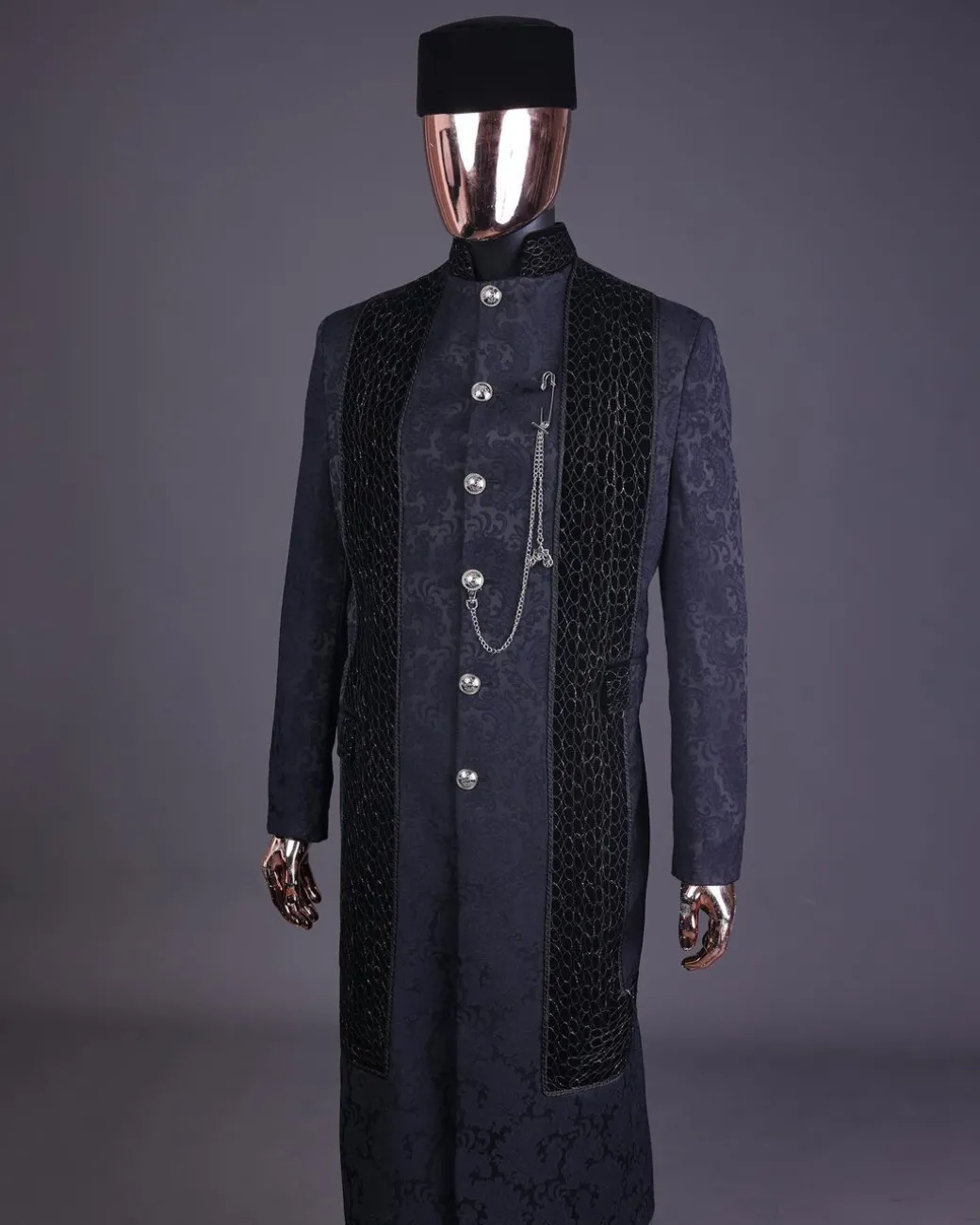 A floral midnight blue “wakanda” with L metallic embroidery, trench jacquard safari suit