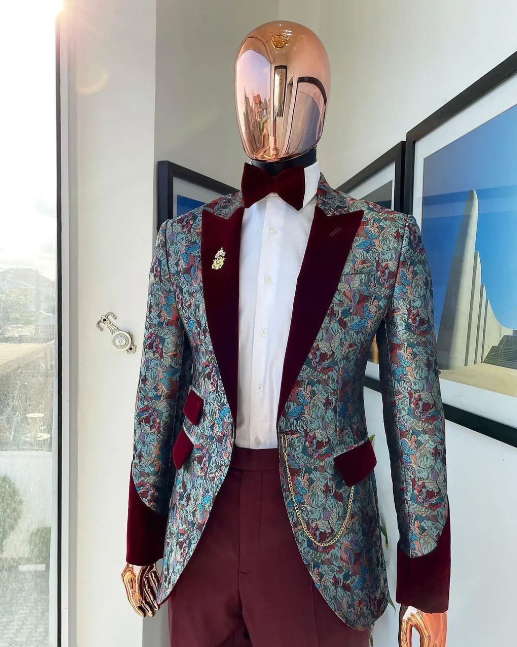 A floral paisley mahogamy red soaked Italian velvet peak lapel suit
