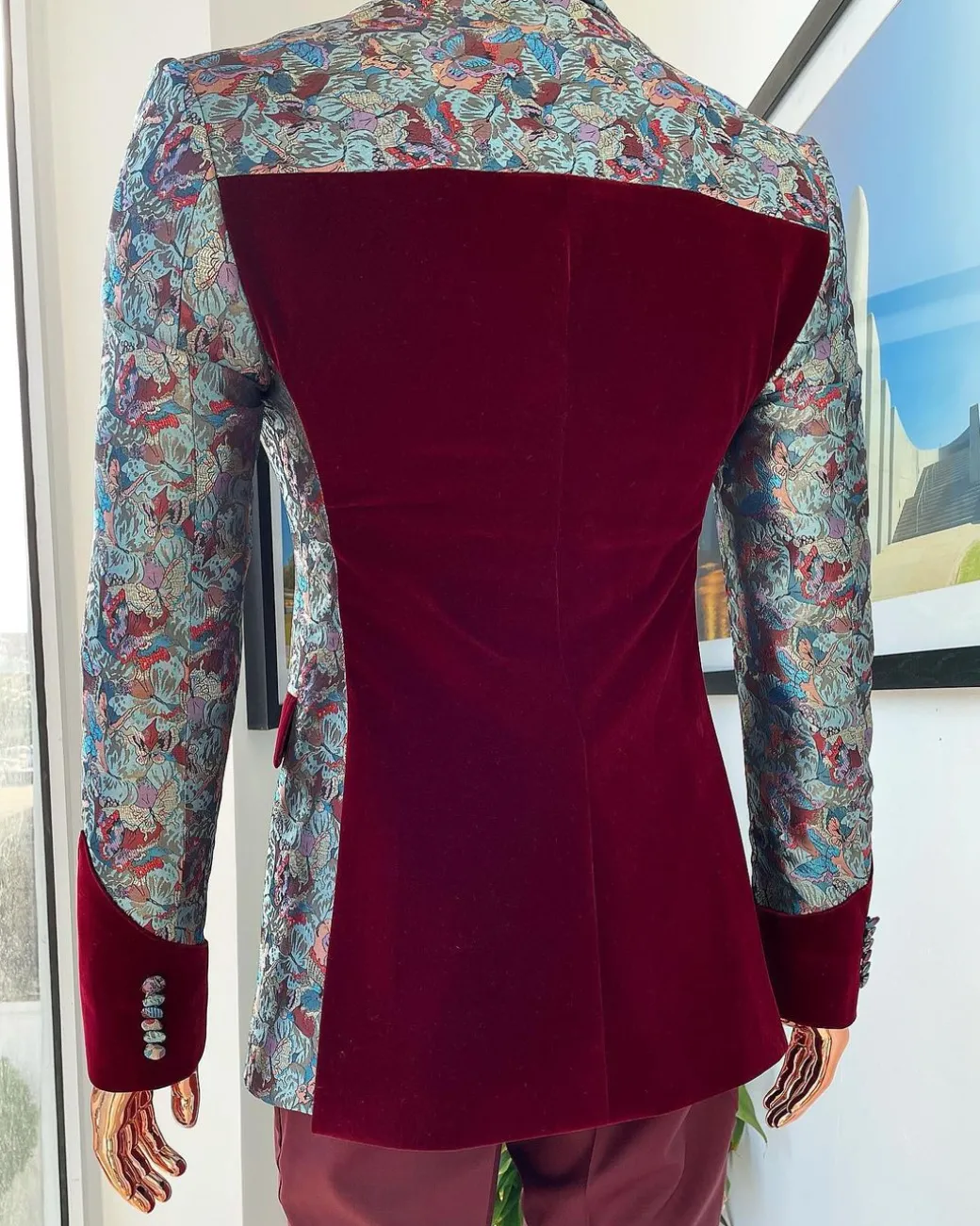 A floral paisley mahogamy red soaked Italian velvet peak lapel suit