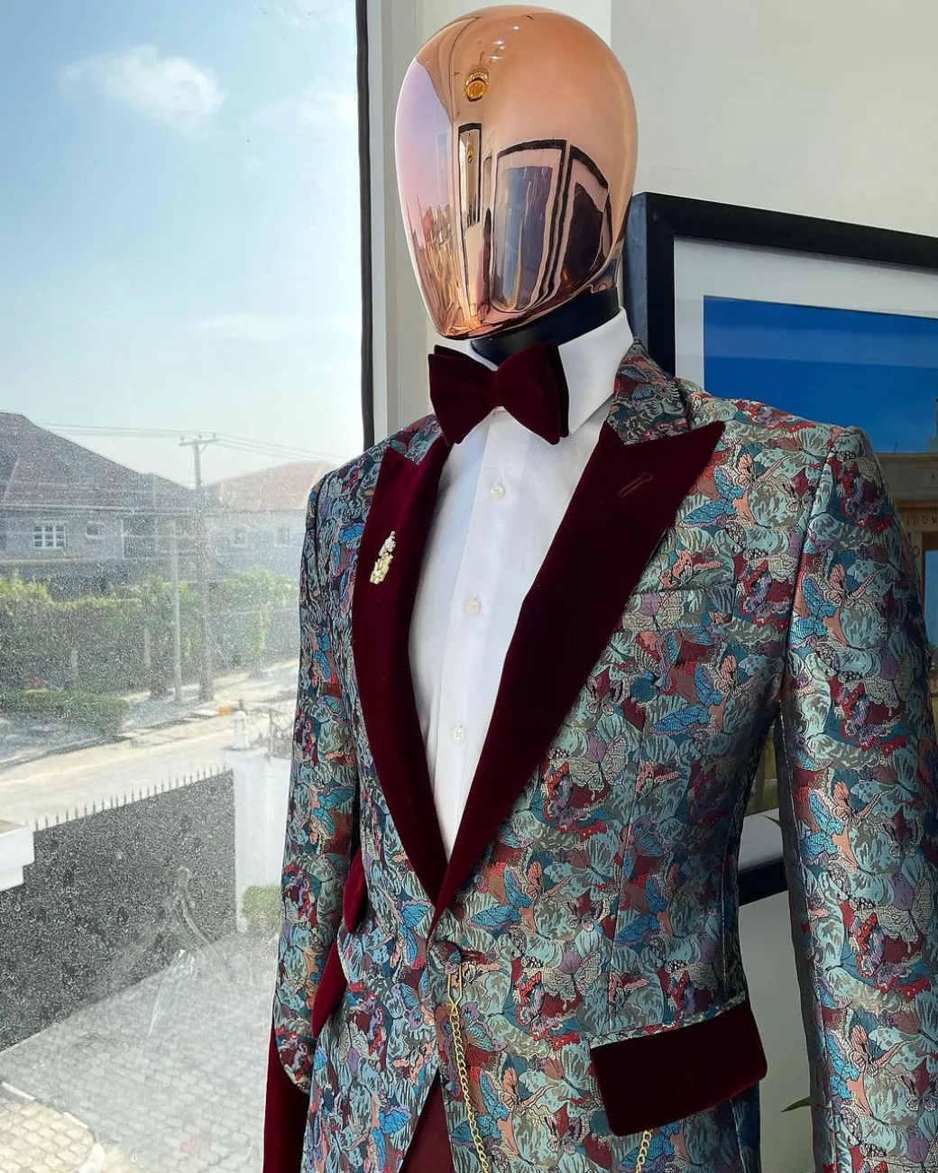 A floral paisley mahogamy red soaked Italian velvet peak lapel suit