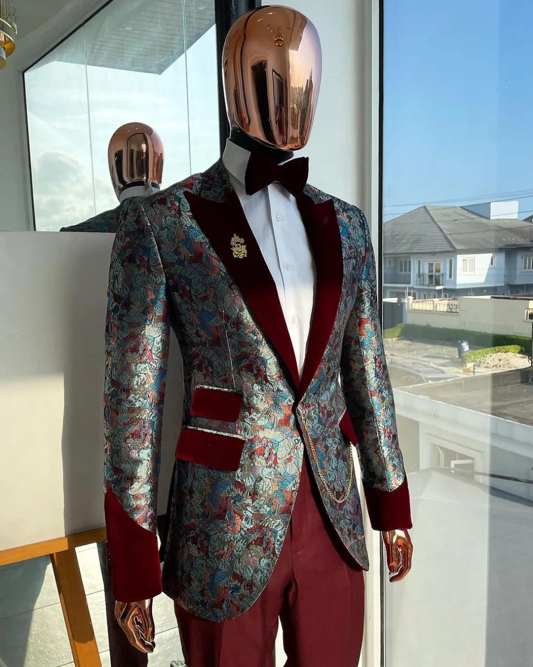 A floral paisley mahogamy red soaked Italian velvet peak lapel suit
