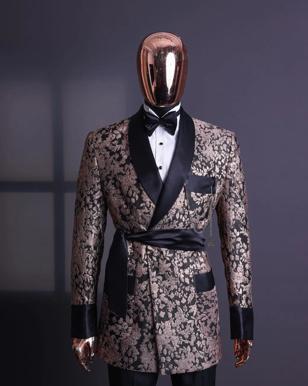 A Floral splashed pink metallic jacquard, shawl lapel wrap tuxedo suit