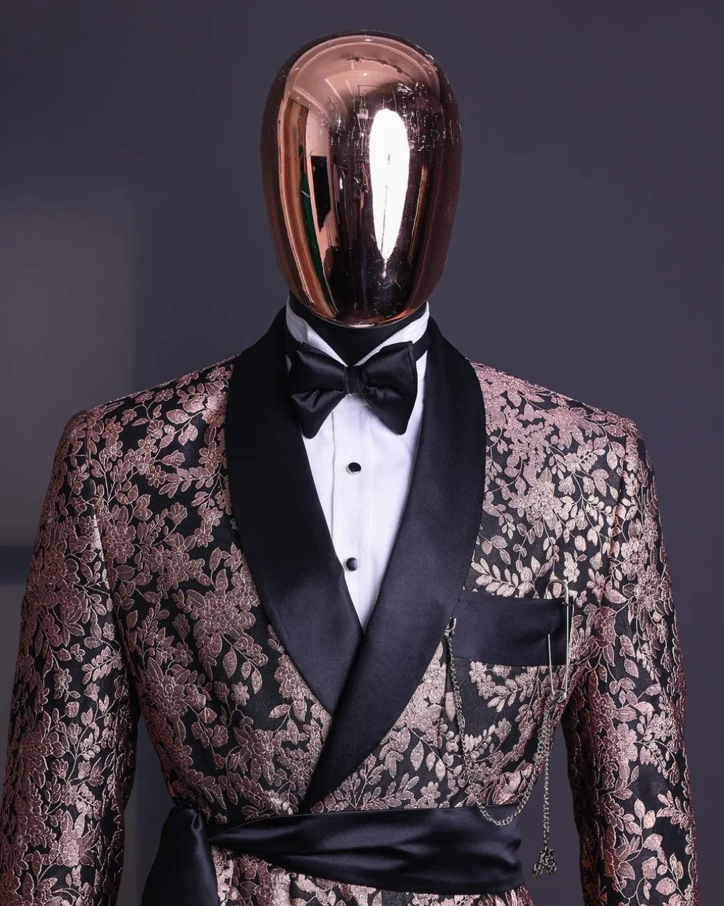 A Floral splashed pink metallic jacquard, shawl lapel wrap tuxedo suit