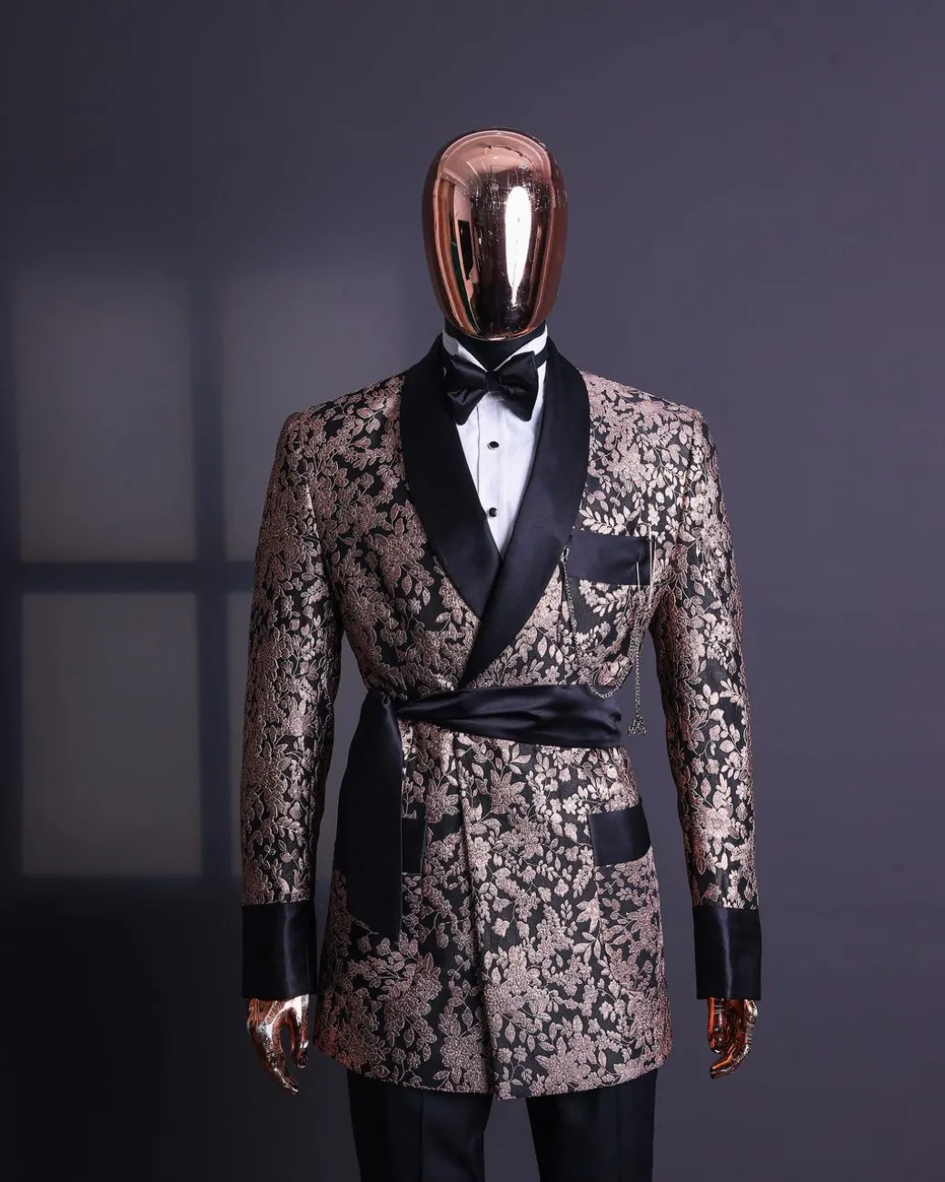 A Floral splashed pink metallic jacquard, shawl lapel wrap tuxedo suit