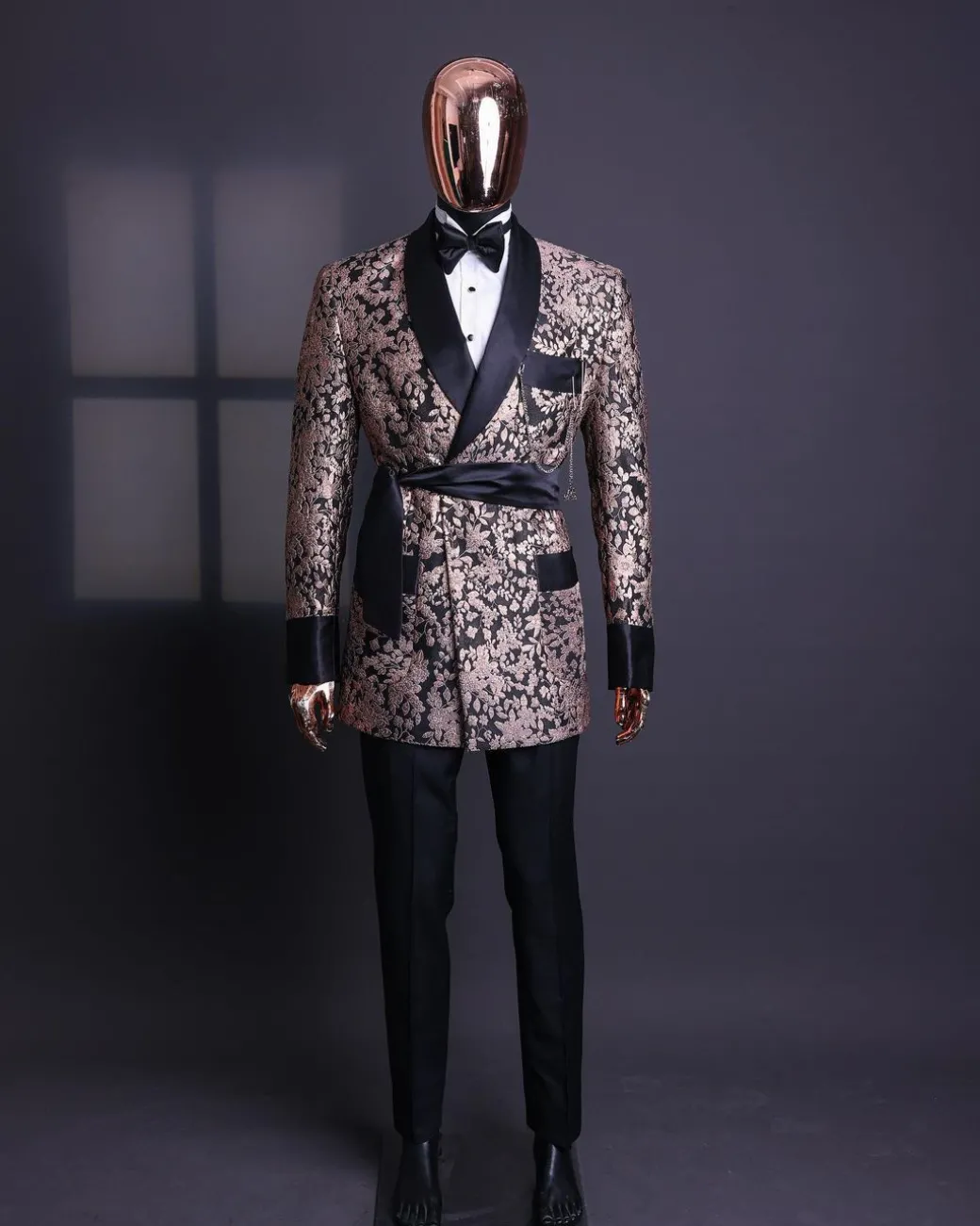 A Floral splashed pink metallic jacquard, shawl lapel wrap tuxedo suit