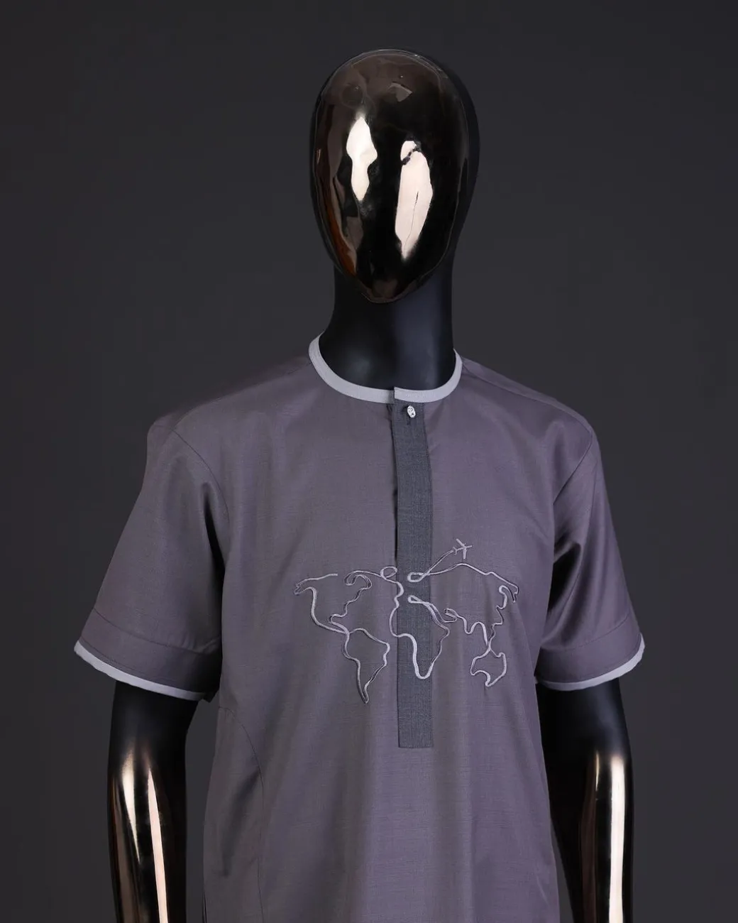 A Fossil grey front flap with crystal Swarovski button, world map embroidery detailing kaftan, and Sokoto