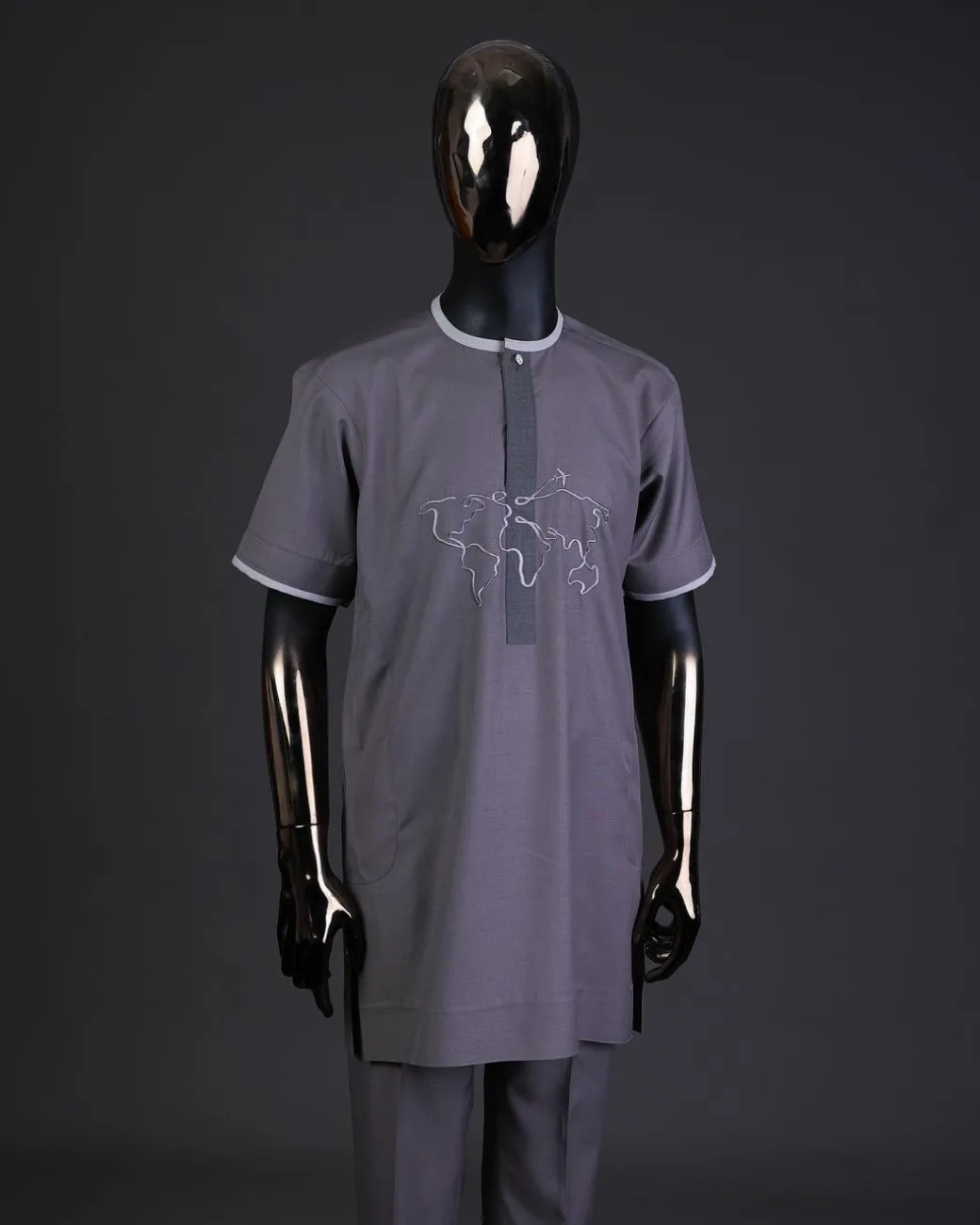 A Fossil grey front flap with crystal Swarovski button, world map embroidery detailing kaftan, and Sokoto