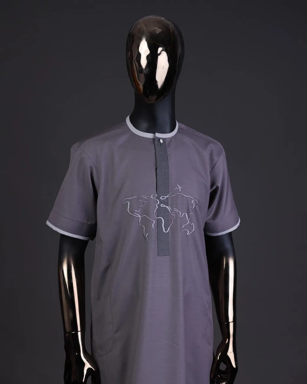 A Fossil grey front flap with crystal Swarovski button, world map embroidery detailing kaftan, and Sokoto