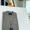 A Fossil Grey, mixed purple Swarovski buttons, vertical flap, knitted embrodery, matching paisley detailing