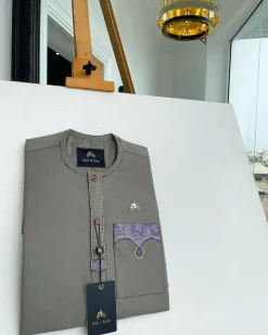 A Fossil Grey, mixed purple Swarovski buttons, vertical flap, knitted embrodery, matching paisley detailing