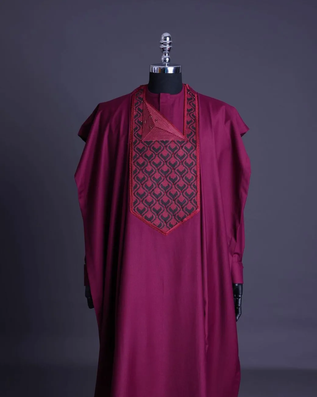 A Garnet red, redundant flame embroidery detailing agbada