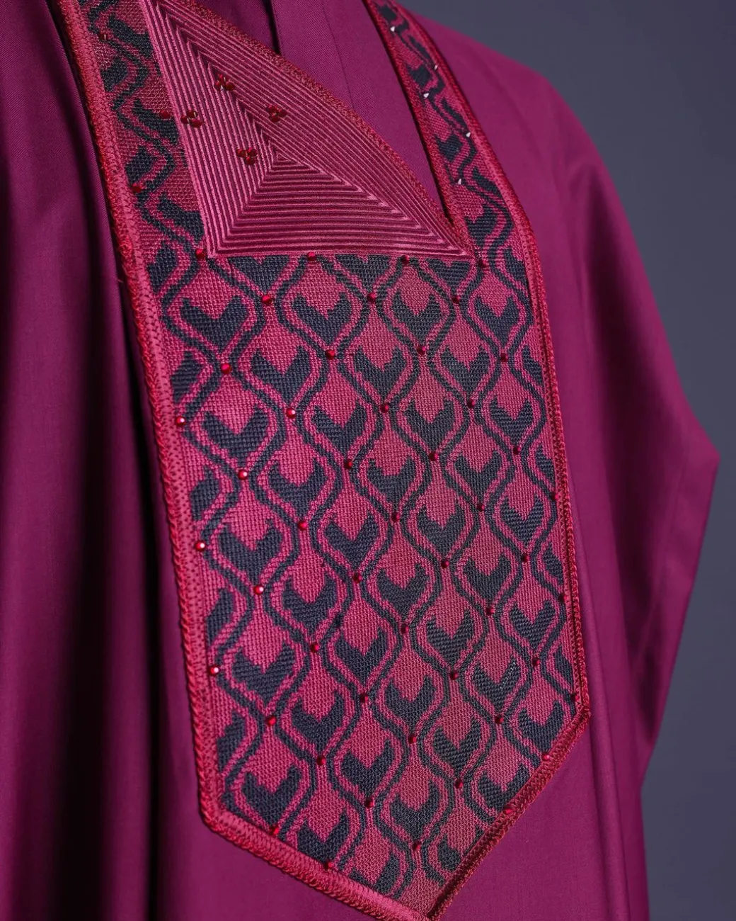 A Garnet red, redundant flame embroidery detailing agbada