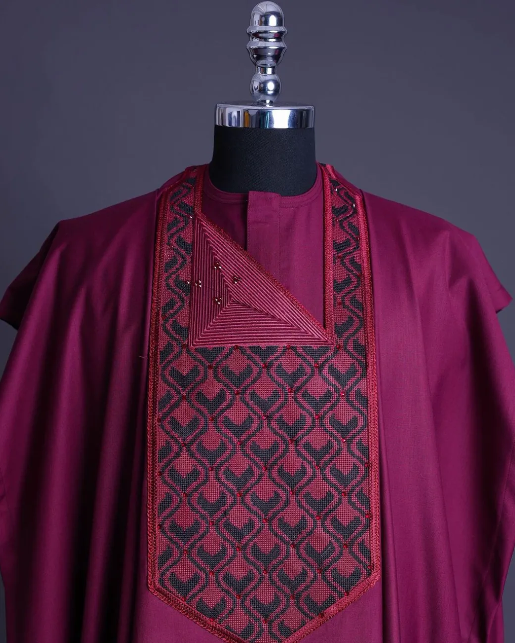 A Garnet red, redundant flame embroidery detailing agbada