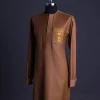 A Gingerbread brown, wide double lane flap, patch pocket with “Golgotha” embroidery detailing African senator kaftan native.