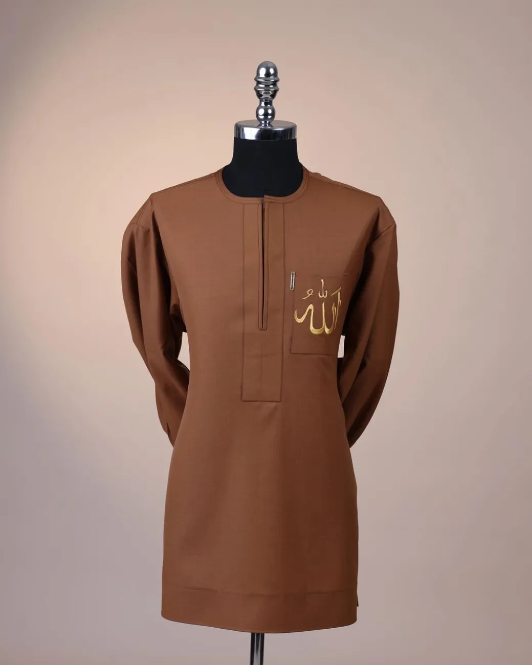 A Gingerbread brown, wide double-lane flap, and embroidery detailing African senator Kaftan native.