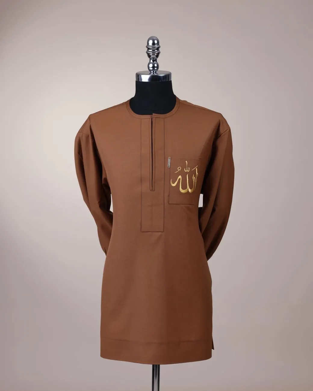 A Gingerbread brown, wide double-lane flap, and embroidery detailing African senator Kaftan native.