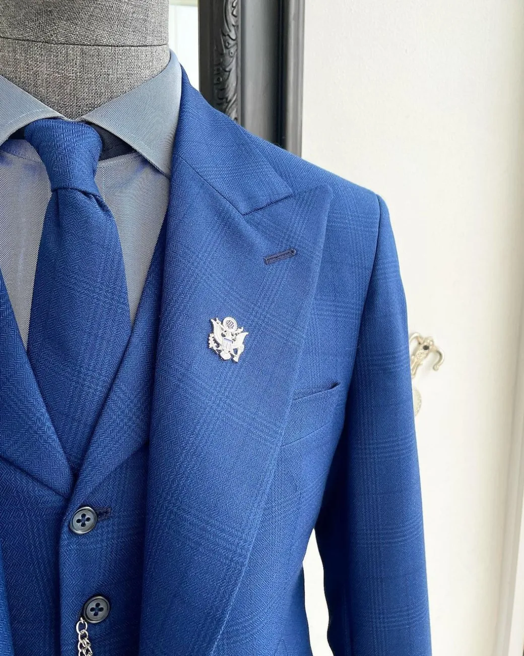 A glen plaid check, lapis blue – nobility – “Board Room” peak lapel suit