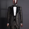 A Gold and black mandarin metallic floral jacquard, peak lapel tuxedo suit