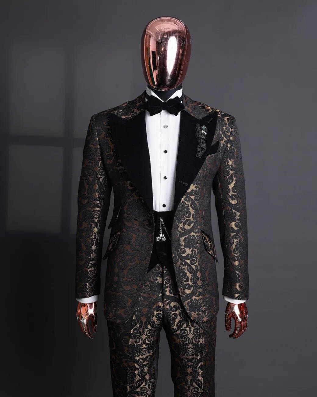 A Gold and black mandarin metallic floral jacquard, peak lapel tuxedo suit