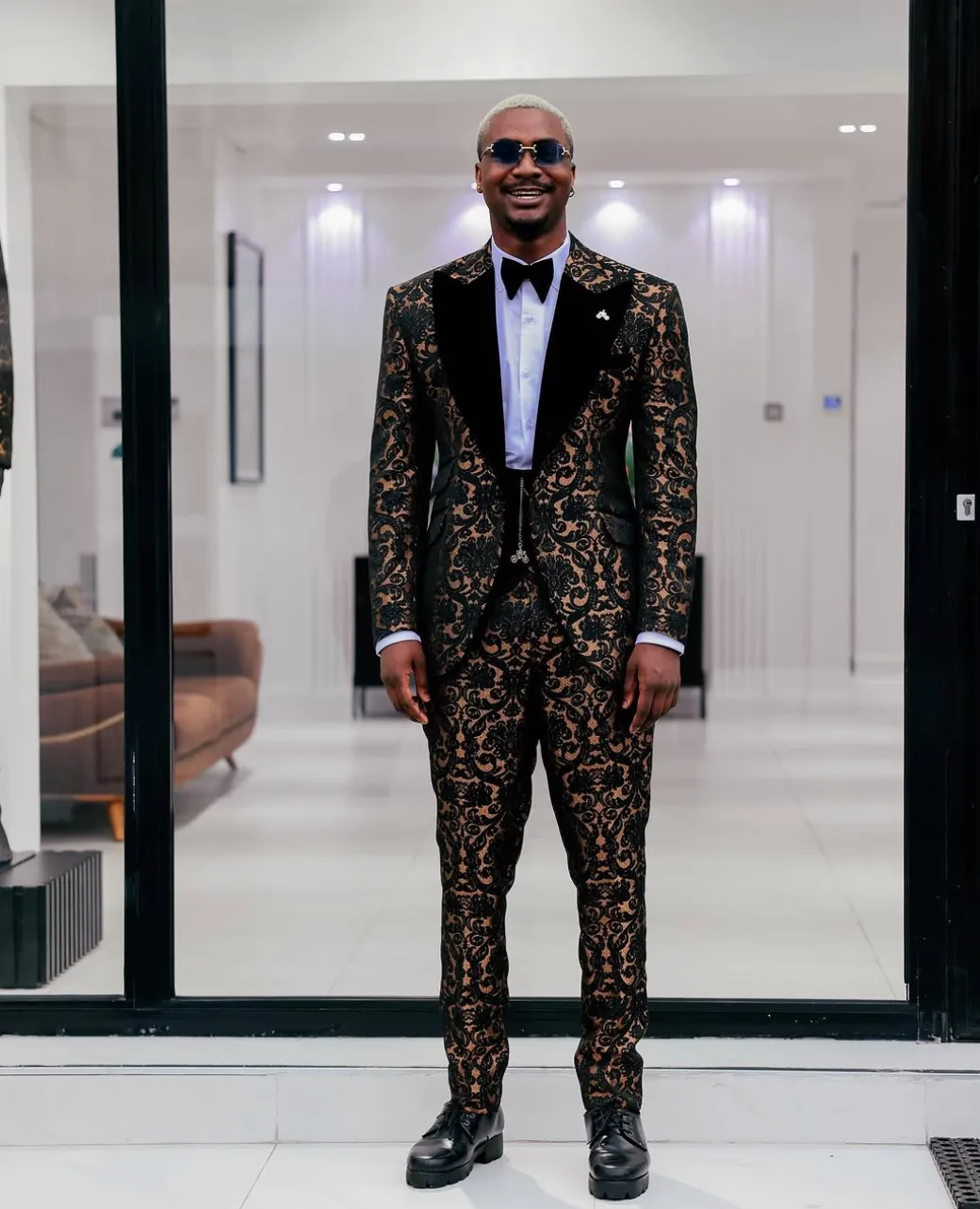 A Gold and black mandarin metallic floral jacquard, peak lapel tuxedo suit
