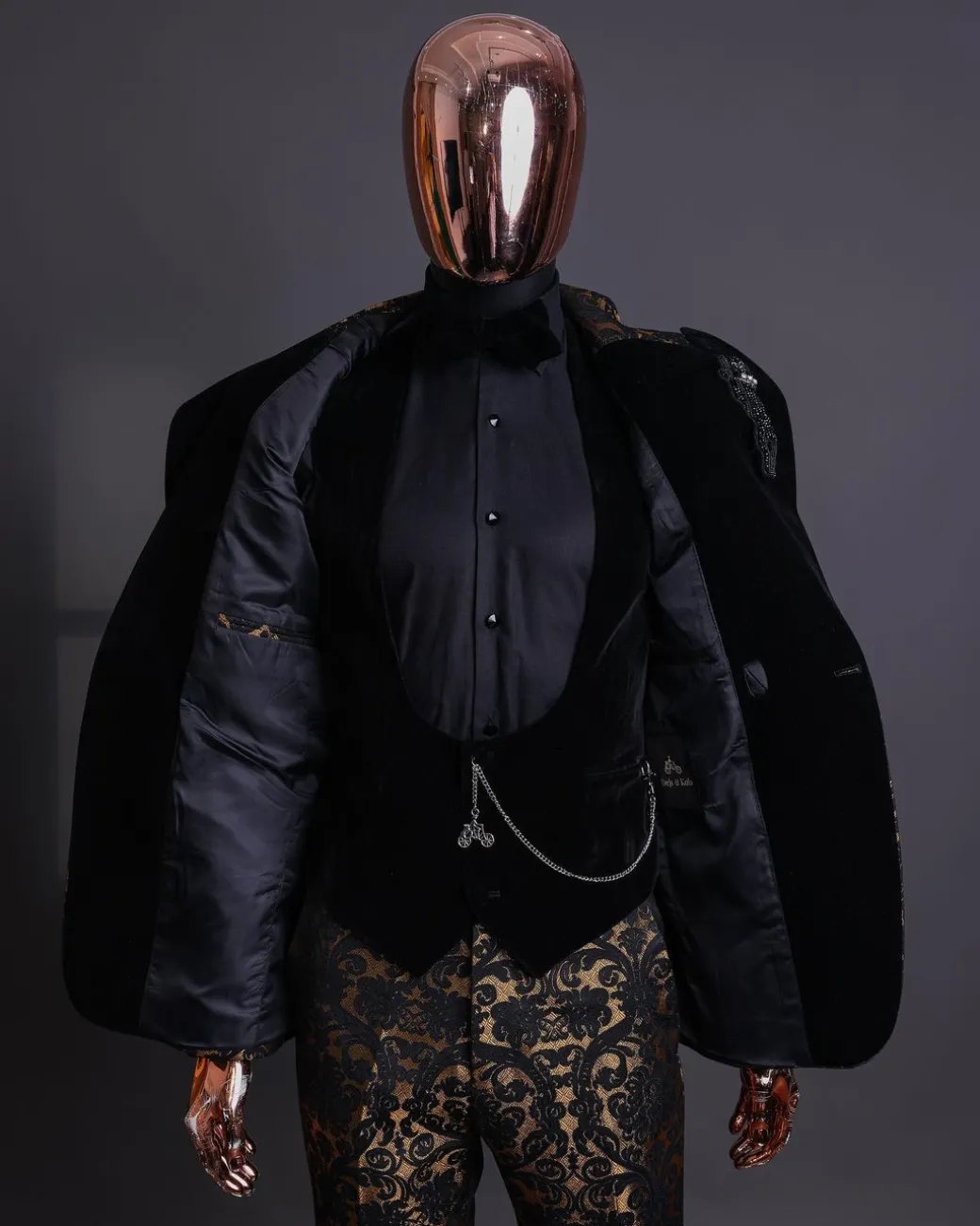 A Gold and black mandarin metallic floral jacquard, peak lapel tuxedo suit.
