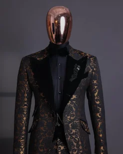 A Gold and black mandarin metallic floral jacquard, peak lapel tuxedo suit.