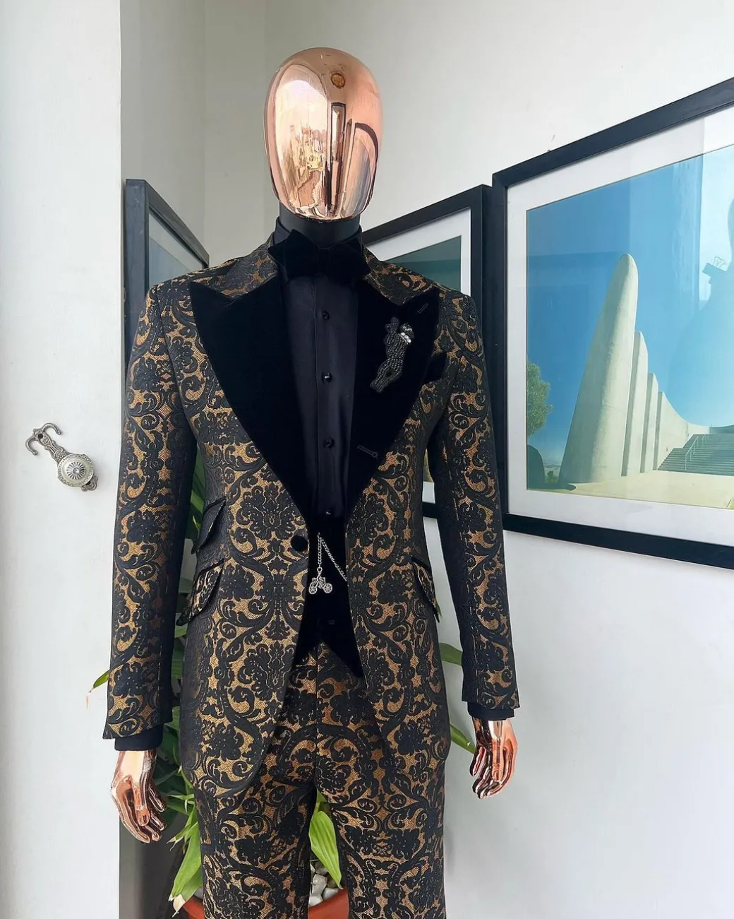 A Gold and black mandarin metallic floral jacquard, peak lapel tuxedo suit.