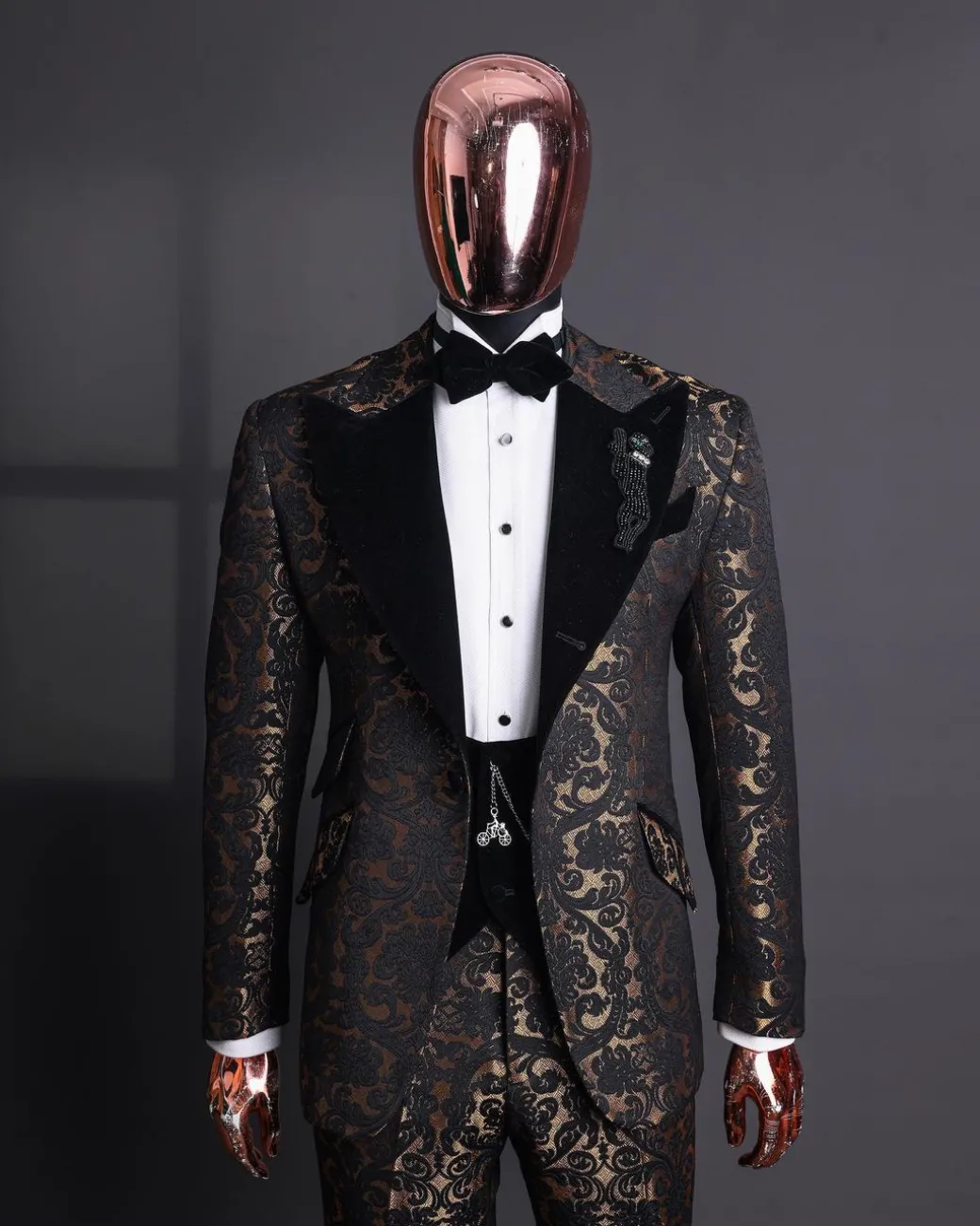 A Gold and black mandarin metallic floral jacquard, peak lapel tuxedo suit