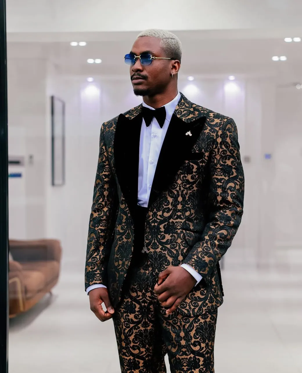 A Gold and black mandarin metallic floral jacquard, peak lapel tuxedo suit