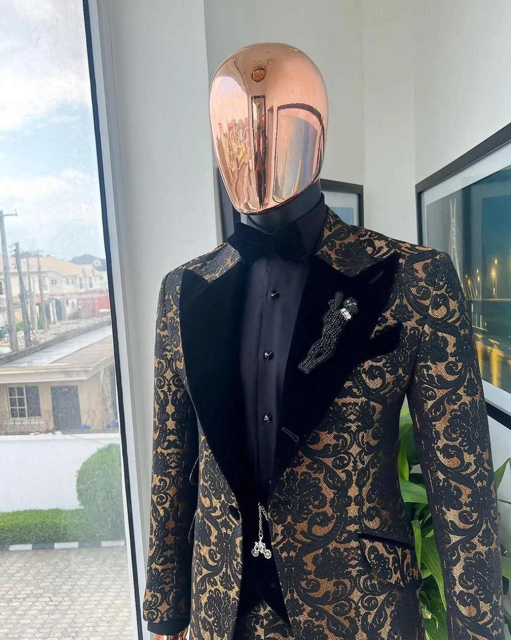 A Gold and black mandarin metallic floral jacquard, peak lapel tuxedo suit.