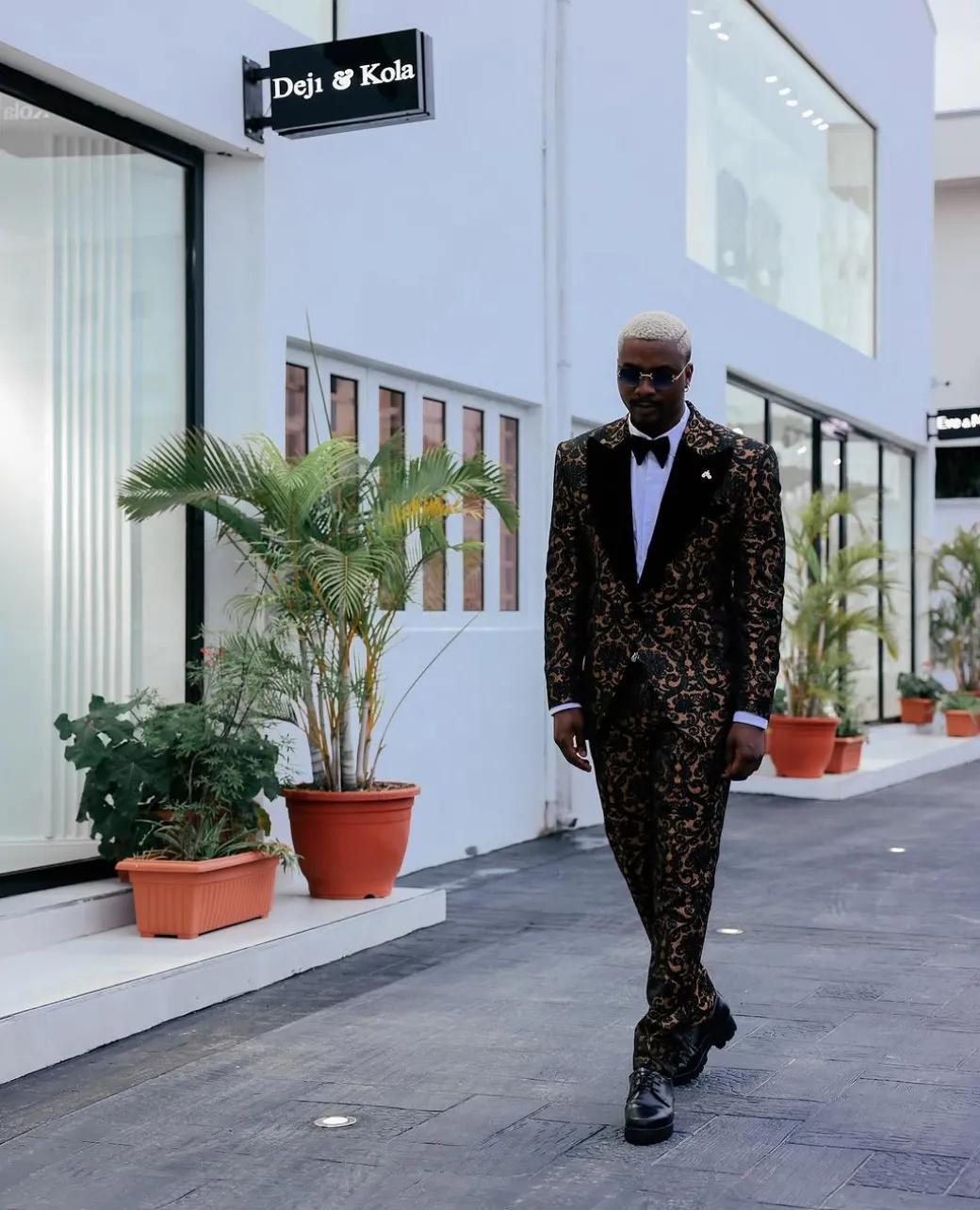 A Gold and black mandarin metallic floral jacquard, peak lapel tuxedo suit