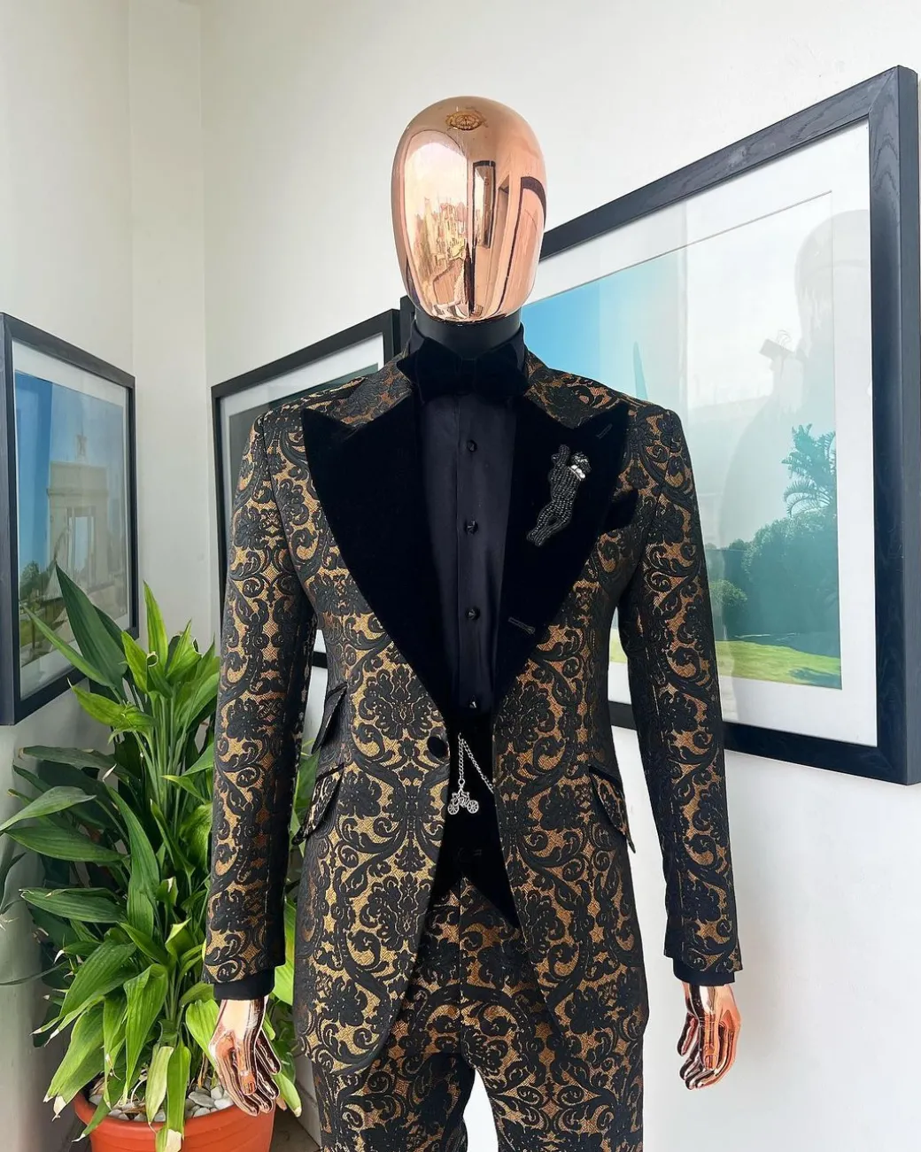A Gold and black mandarin metallic floral jacquard, peak lapel tuxedo suit.