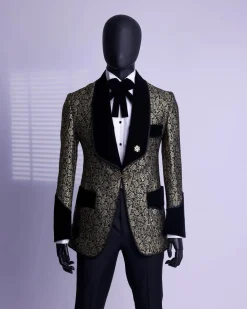 A Gold and black patterned metallic Jacquard tuxedo suit with sharaba wooven edge detailing