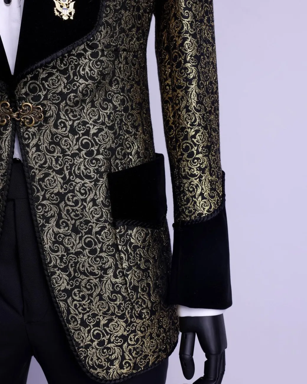 A Gold and black patterned metallic Jacquard tuxedo suit with sharaba wooven edge detailing