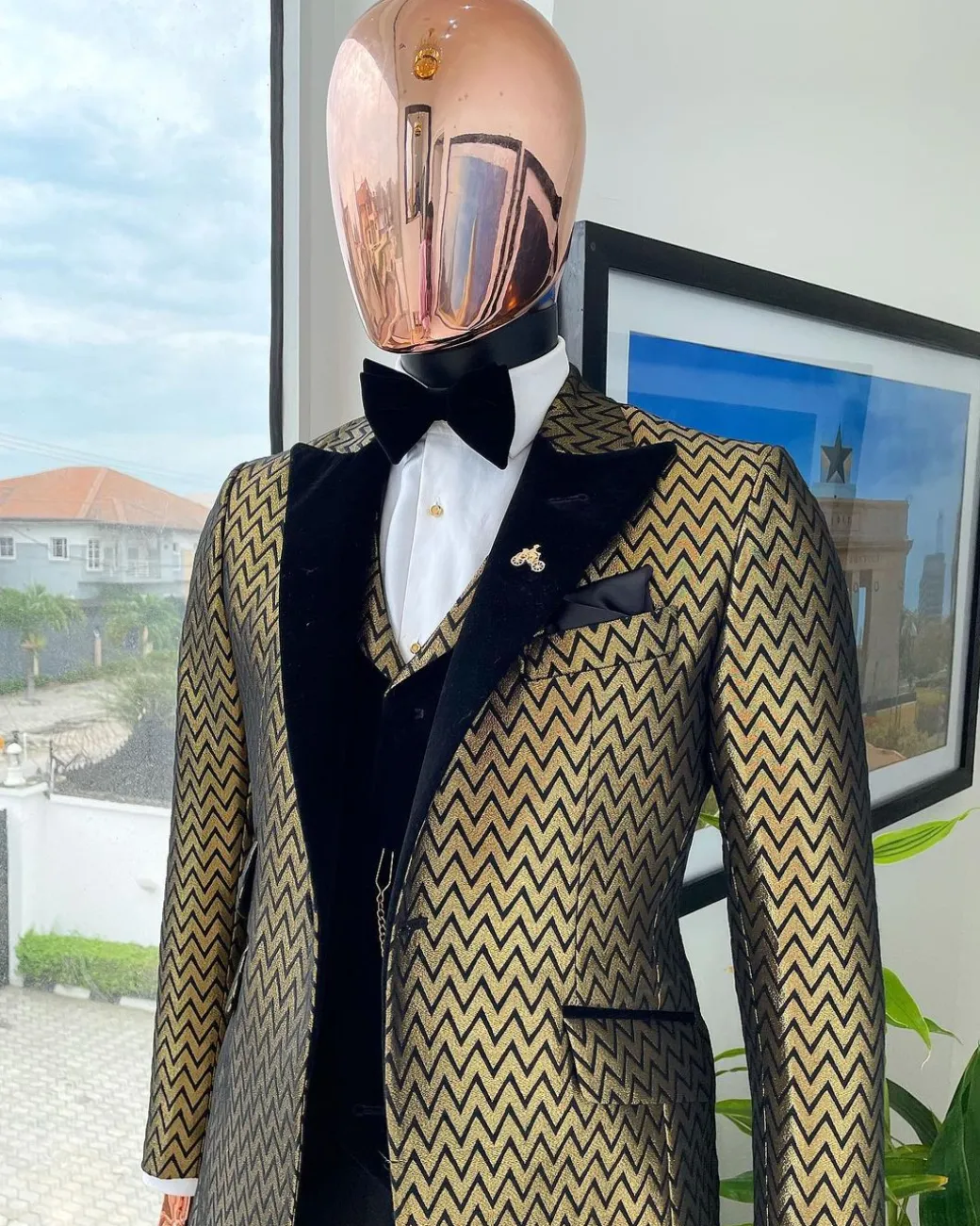 A Gold And Black Zig-Zag Pattern Tuxedo Suit