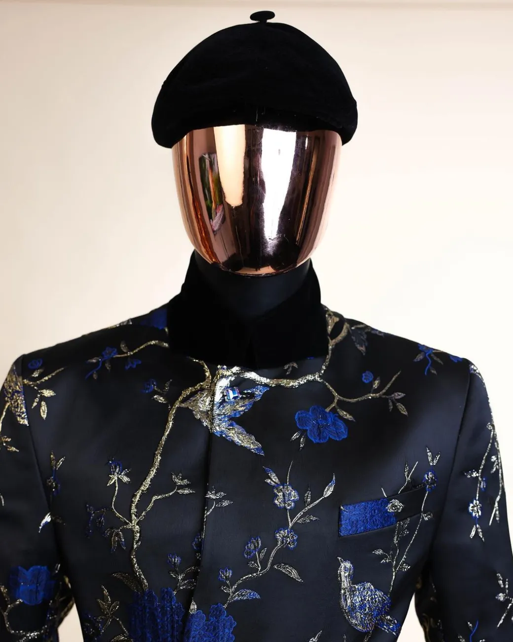 A Gold, black and blue double breasted safari suit, raven and forest metallic pattern jacquard